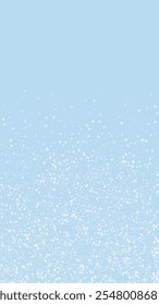 Magic falling snow christmas background. Subtle flying snow flakes and stars on light blue winter backdrop. Magic falling snow holiday scenery.   Vertical vector illustration.