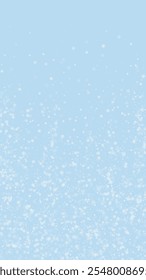 Magic falling snow christmas background. Subtle flying snow flakes and stars on light blue winter backdrop. Magic falling snow holiday scenery.   Vertical vector illustration.