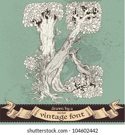 Magic grunge forest hand drawn by a vintage font - K