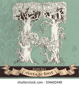Magic grunge forest hand drawn by a vintage font - H