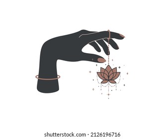 Magic hand with hanging lotus flower in trendy boho style. Black and gold colored alchemy spiritual symbol for branding name and logo. Esoteric and mystical design element. Vector illustration