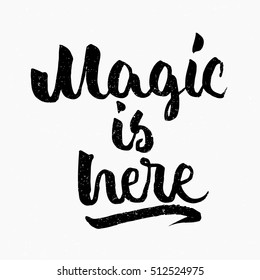 Magic is here quote. Ink hand lettering. Modern brush calligraphy. Handwritten phrase. Inspiration graphic design typography element. Cute simple vector sign.