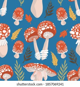 Magic mushrooms autumn seamless pattern on blue background with red toadstools, yellow and orange leaves. Hand drawn vector illustration for title, fabric, textiles, prints