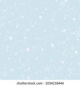 Magic snowflakes seamless pattern on light blue Christmas background.