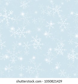 Magic snowflakes seamless pattern on light blue Christmas background.