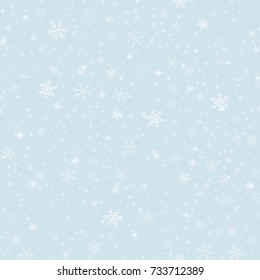 Magic snowflakes seamless pattern on light blue Christmas background.