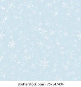 Magic snowflakes seamless pattern on light blue Christmas background.