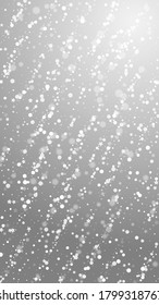 Magic stars Christmas background. Subtle flying snow flakes and stars on grey background. Amazing winter silver snowflake overlay template. Attractive vertical illustration.