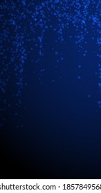 Magic stars Christmas background. Subtle flying snow flakes and stars on dark blue background. Alive winter silver snowflake overlay template. Wonderful vertical illustration.