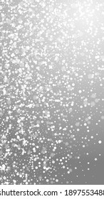 Magic stars Christmas background. Subtle flying snow flakes and stars on grey background. Amusing winter silver snowflake overlay template. Interesting vertical illustration.