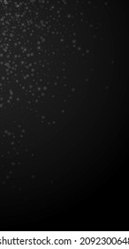 Magic stars Christmas background. Subtle flying snow flakes and stars on black background. Adorable winter silver snowflake overlay template. Fresh vertical illustration.