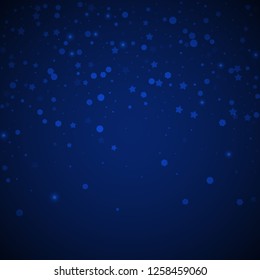 Magic stars random Christmas background. Subtle flying snow flakes and stars on dark blue night background.