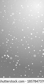 Magic stars random Christmas background. Subtle flying snow flakes and stars on grey background. Amazing winter silver snowflake overlay template. Beauteous vertical illustration.