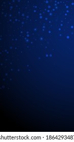 Magic stars random Christmas background. Subtle flying snow flakes and stars on dark blue background. Alluring winter silver snowflake overlay template. Sublime vertical illustration.