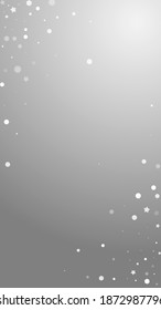 Magic stars random Christmas background. Subtle flying snow flakes and stars on grey background. Adorable winter silver snowflake overlay template. Dramatic vertical illustration.