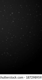 Magic stars random Christmas background. Subtle flying snow flakes and stars on black background. Amazing winter silver snowflake overlay template. Authentic vertical illustration.