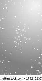 Magic stars random Christmas background. Subtle flying snow flakes and stars on grey background. Adorable winter silver snowflake overlay template. Trending vertical illustration.