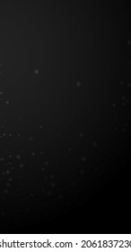 Magic stars random Christmas background. Subtle flying snow flakes and stars on black background. Alluring winter silver snowflake overlay template. Fine vertical illustration.
