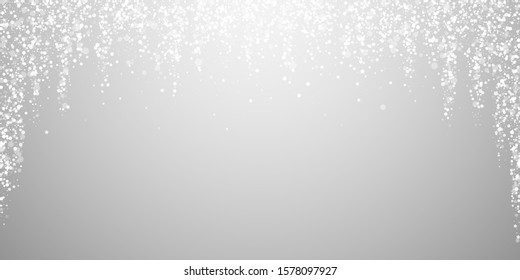 Magic stars sparse Christmas background. Subtle flying snow flakes and stars on light grey background. Attractive winter silver snowflake overlay template. Stunning vector illustration.