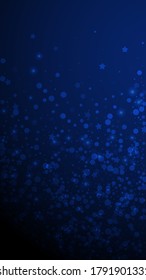 Magic stars sparse Christmas background. Subtle flying snow flakes and stars on dark blue background. Amazing winter silver snowflake overlay template. Precious vertical illustration.