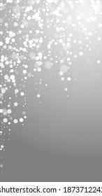 Magic stars sparse Christmas background. Subtle flying snow flakes and stars on grey background. Alluring winter silver snowflake overlay template. Tempting vertical illustration.