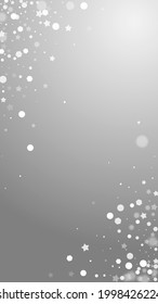 Magic stars sparse Christmas background. Subtle flying snow flakes and stars on grey background. Adorable winter silver snowflake overlay template. Eminent vertical illustration.