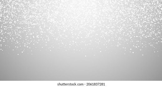 Magic stars sparse Christmas background. Subtle flying snow flakes and stars on light grey background. Beauteous winter silver snowflake overlay template. Noteworthy vector illustration.