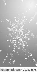 Magic stars sparse Christmas background. Subtle flying snow flakes and stars on grey background. Alive winter silver snowflake overlay template. Fair vertical illustration.