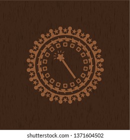 magic stick icon inside badge with wood background