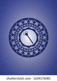 magic stick icon inside badge with jean texture