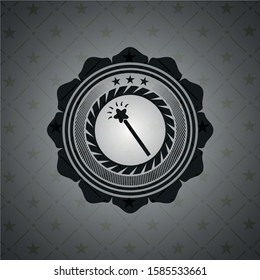 magic stick icon inside black emblem