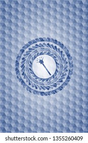 magic stick icon inside blue polygonal emblem.