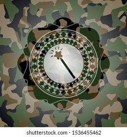 magic stick icon inside camouflaged emblem