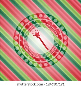 magic stick icon inside christmas emblem.