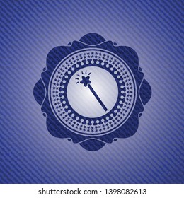 magic stick icon inside denim background