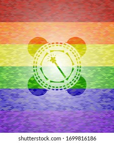 icono de magia en el interior del emblema sobre fondo de mosaico con los colores de la bandera LGBT