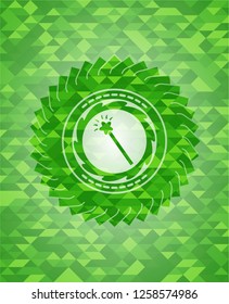 magic stick icon inside green mosaic emblem