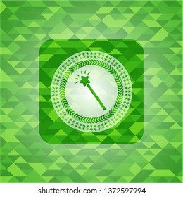 magic stick icon inside green emblem with mosaic background