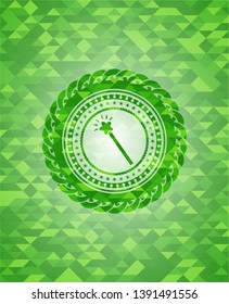 magic stick icon inside green mosaic emblem