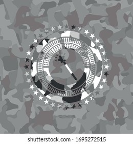 magic stick icon inside grey camouflage texture