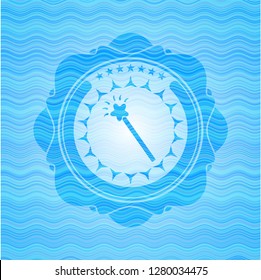 magic stick icon inside light blue water style emblem.