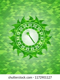 magic stick icon inside realistic green mosaic emblem