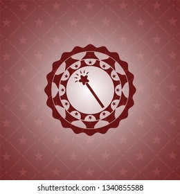 magic stick icon inside red icon or emblem