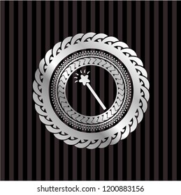 magic stick icon inside silvery badge or emblem
