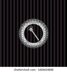 magic stick icon inside silvery badge or emblem
