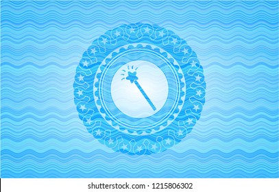 magic stick icon inside sky blue water style emblem.
