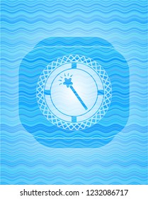 magic stick icon inside sky blue water wave style badge.