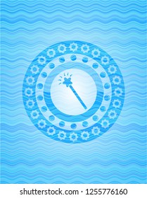 magic stick icon inside water badge background.