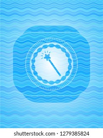 magic stick icon inside water concept emblem.