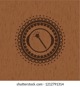 magic stick icon inside wood badge or emblem